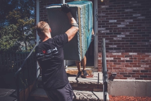 Allston movers moving a couch
