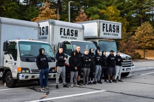 movers near the trucks Flash Moving & Storage, Waltham movers