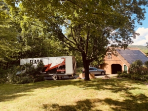 Moving Company in Cary NC, Cary Movers, truck parked near house Flash Moving & Storage